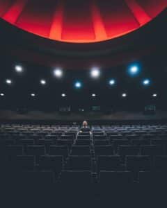 man sitting alone in theater